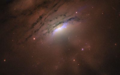 El Hubble Captura hermosa foto de una galaxia distante y su sombra